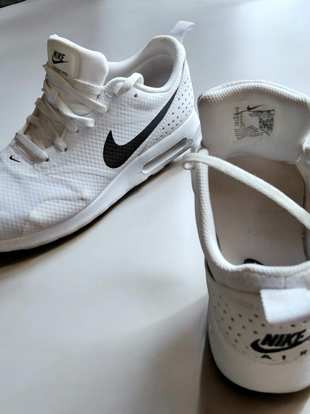 Nike White Sneakers with Black Swoosh Accent